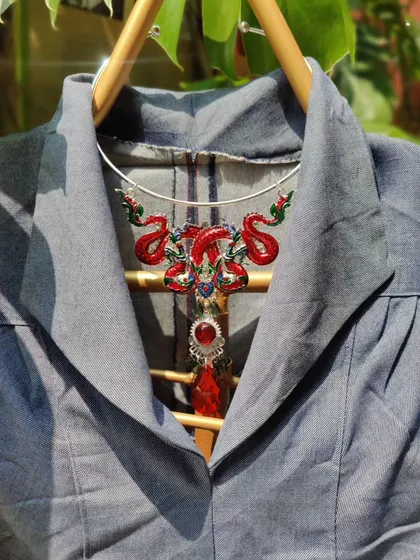 This striking red dragon choker is a centerpiece of my Autumn collection. It's a powerful Feng Shui piece that adds a dramatic and artistic element when paired with a simple collared dress.