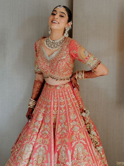 The pure, uninhibited joy of a bride on her wedding day. This candid shot perfectly captures her happiness and excitement.
