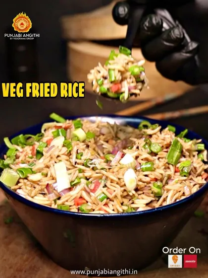Simple, classic, and always delicious. Our Veg Fried Rice is tossed with fresh vegetables and seasoned to perfection.