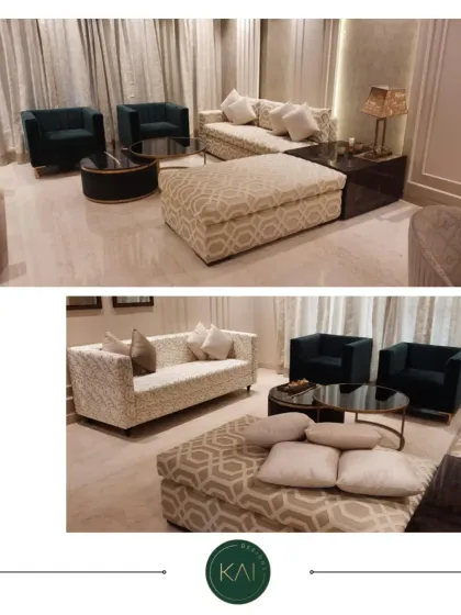 This living room arrangement combines different patterns and textures for a dynamic look. A geometrically patterned ottoman, a textured white sofa, and solid dark armchairs create a layered and sophisticated seating area.