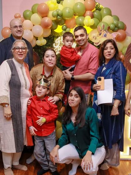 A large family group gathers for a photo, all smiles. Our space can comfortably accommodate your entire guest list, from toddlers to grandparents.