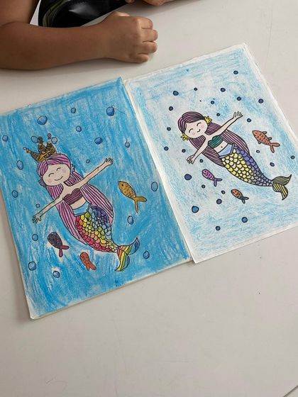 Two lovely mermaid drawings by two friends in my class. It's always fun to see how each student adds their unique touch to the same subject.