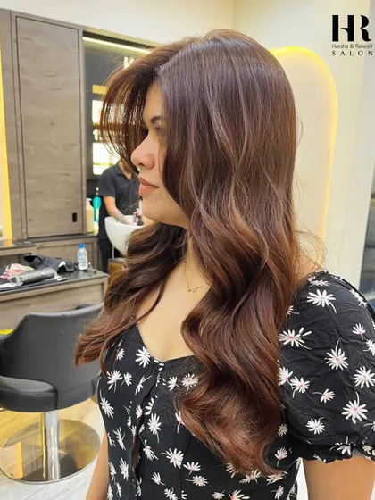 A side profile of the client, highlighting how the new color and style frame her face.