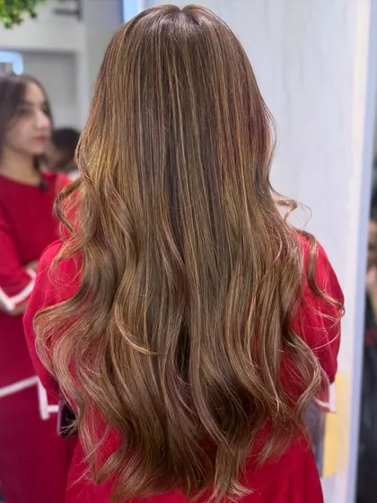 Another angle of the softly illuminated bronde. This color is perfect for those who want a lighter look that is still natural and sophisticated.