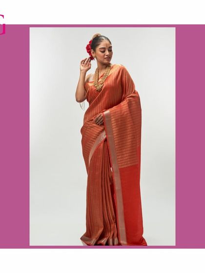 A full-length portrait in the orange silk linen saree, a perfect example of making a sophisticated statement with color.