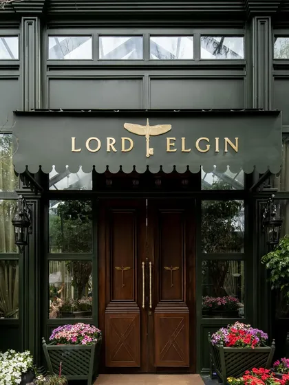 The entrance canopy with the "Lord Elgin" branding, establishing a sense of classic, old-world luxury.