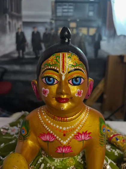 A close-up of the 'after' result. I repainted the face with delicate details like lotus flowers and peacock feathers to give it a divine look.