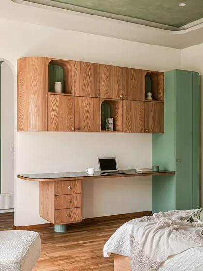 A different view of the study area, showing how the green accent color is carried through to the full-height storage unit and the painted ceiling inset.