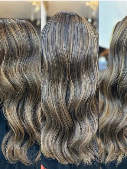 This look combines a global base color with expertly placed balayage highlights, all protected by an Olaplex treatment. The result is a multi-tonal, vibrant style with incredible shine.
