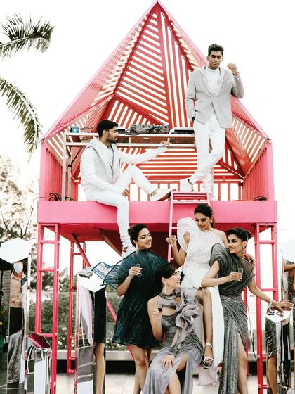 The DJ console is the star of an after-party. We designed this artistic pink house-like structure for the DJ, making it a cool photo booth and the focal point of the evening.