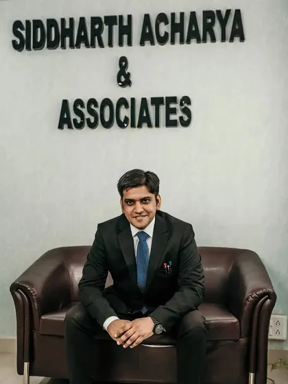 A formal portrait at my firm, Siddharth Acharya & Associates.