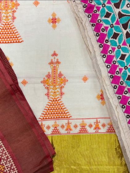 A beautiful display of different embroidered fabrics and pieces at my studio sale. You can see the variety of colors and styles, from Kasuti to patchwork.