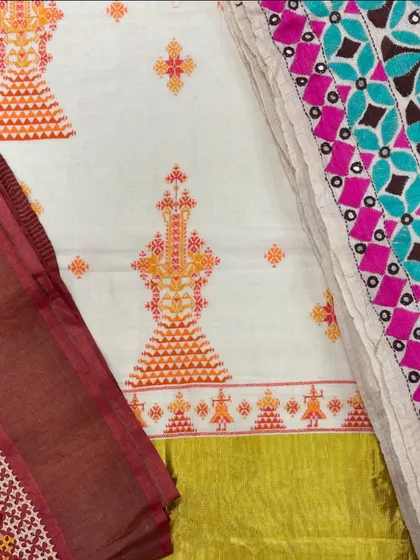 A beautiful display of different embroidered fabrics and pieces at my studio sale. You can see the variety of colors and styles, from Kasuti to patchwork.