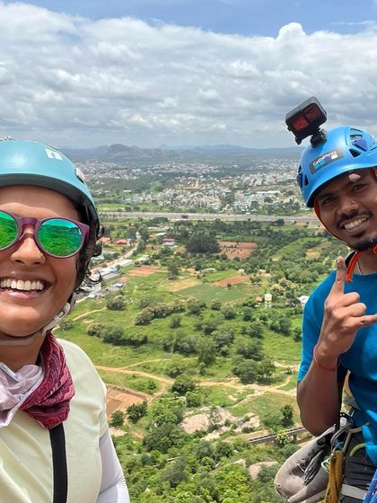 A selfie from high up on Talai Betta, with the city in the distance. The views are a fantastic reward for the effort.