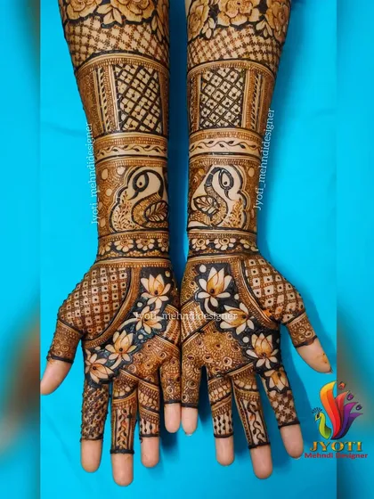 This full bridal design is an excellent example of combining multiple techniques: peacock figures, lotus cutwork, and various intricate filler patterns.