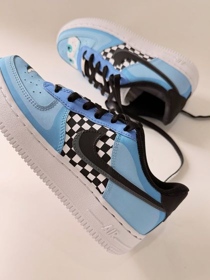 An angled shot of the Sally Carrera sneaker. The light blue colour and subtle details make it a chic and fun tribute to the character.