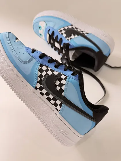 An angled shot of the Sally Carrera sneaker. The light blue colour and subtle details make it a chic and fun tribute to the character.