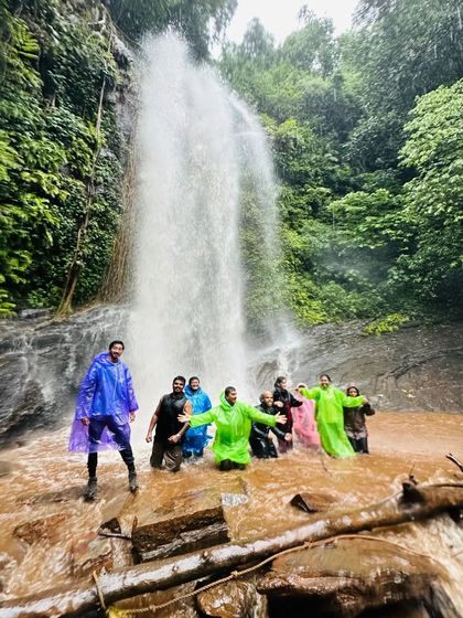 Our group enjoying the refreshing waters of Hidlumane Falls on the Kodachadri trek, a perfect break during the climb.