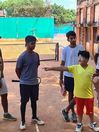 A young player gets the chance to ask a question to Olympic champion Neeraj Chopra during his visit.