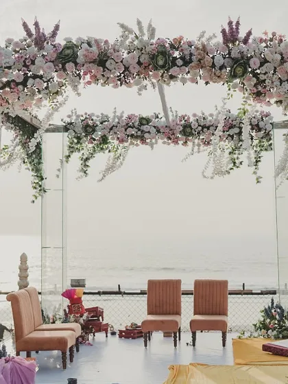 For this beachside wedding, the view was the star. I designed a minimalist, transparent mandap with a floating floral canopy, ensuring the ocean remained the breathtaking backdrop for the ceremony.
