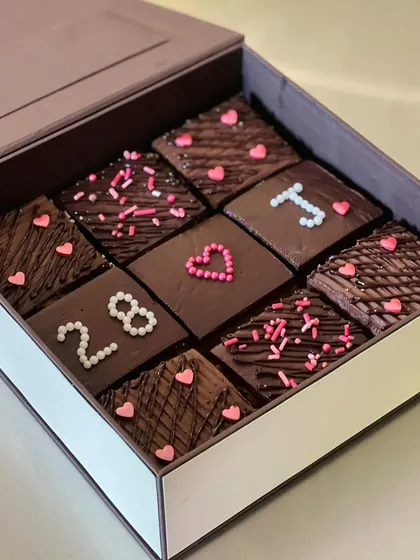 Another look at my customized chocolate bars, perfect for anniversaries or birthdays. These were decorated with the number 28 and little pink hearts for a personal touch.