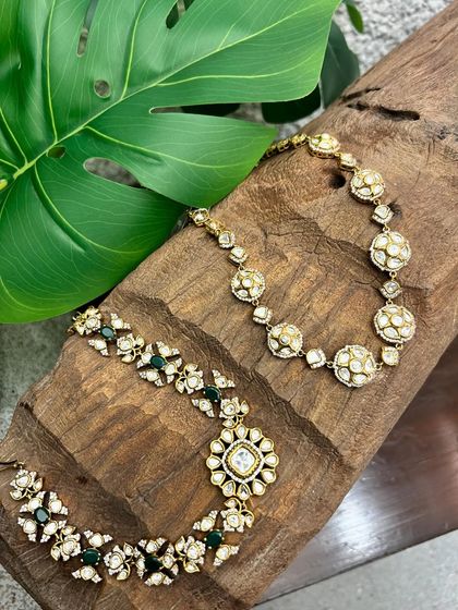 A wider view of the two kundan necklaces, showcasing their intricate craftsmanship and timeless appeal.