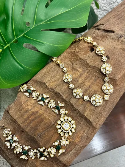 A wider view of the two kundan necklaces, showcasing their intricate craftsmanship and timeless appeal.