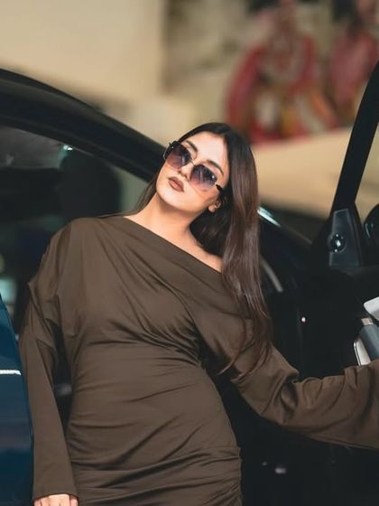 Getting into the Harrier.ev, this image highlights the car's interior and my 'boss girl' persona. It’s a moment that feels both luxurious and powerful, perfect for an automotive collaboration.