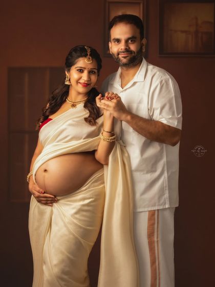 A happy couple's portrait in traditional South Indian attire, capturing their shared joy and cultural pride.