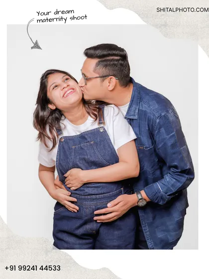 A playful and happy moment from a casual couple's maternity shoot. A gentle kiss on the cheek shows the affection and joy that surrounds this special time.