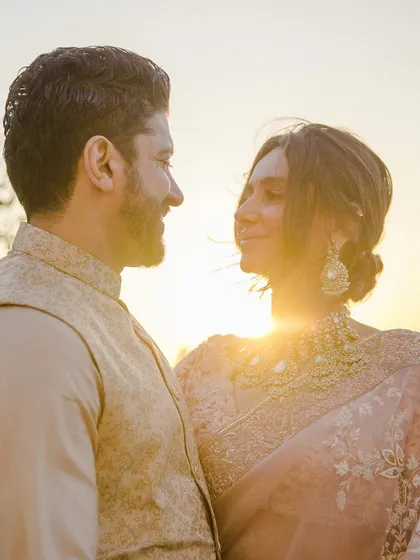 Shibani and Farhan share a look in the golden hour light. This warm, intimate portrait captures the beautiful, gentle light that radiates from them as a couple.