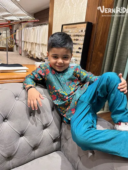 Our client looking cool and relaxed in a vibrant printed kurta set, proving that ethnic wear can be both stylish and easy to wear.