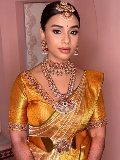 A direct portrait capturing the regal feel of her Muhurtham look. The makeup is designed to be timeless and photograph beautifully.