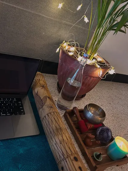 The tools I use to support my breathwork sessions, including a rainstick, singing bowl, and crystals. These elements help ground the energy and deepen the experience of dropping into the heart space.
