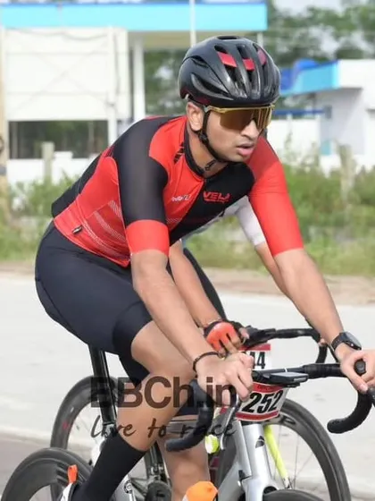An elite rider from the Velo racing team, focused on the race ahead.