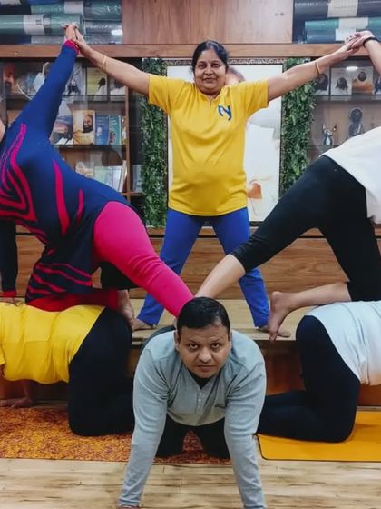 This beautiful partner yoga formation shows how students of all levels can come together to create something unique and supportive.