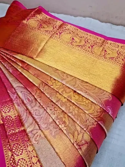 Another angle of this beautiful pink and gold silk saree, showing the consistency of the pleats.