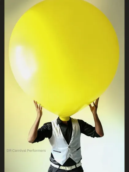 Balloons aren't just for parties, they are for creating unforgettable moments. Our Balloon Man act, where a performer's head is inside a giant balloon, is where fun and art collide.