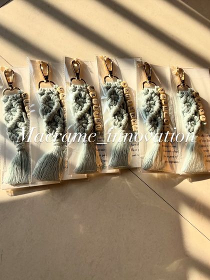 A set of light grey personalized keychains. This neutral color is so chic and goes with everything.