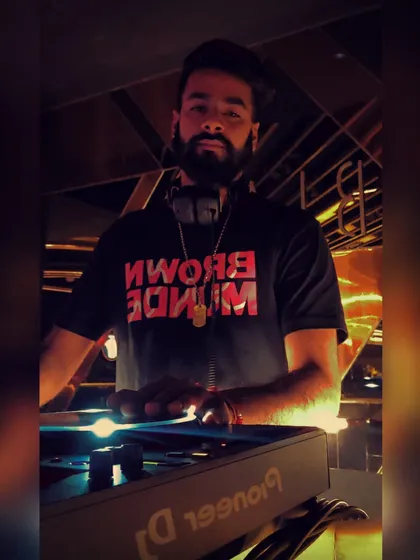 Rocking my "Brown Munde" shirt during a set. I specialize in dropping the latest and greatest Punjabi anthems from artists like AP Dhillon, ensuring an authentic and high energy experience for fans of desi beats.