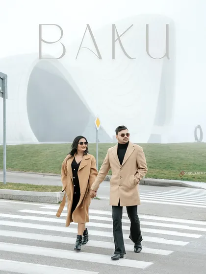 A chic pre-wedding portrait in Baku, Azerbaijan, with the couple posing against the city's stunning modern architecture. This shows my versatility in capturing love stories in any setting, from ancient palaces to contemporary cityscapes.