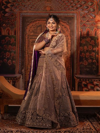 This full-length view shows the grandeur of the lehenga. The intricate work on the skirt and the elegant fall of the fabric are designed to make a lasting impression. It’s a piece that combines tradition with modern style.