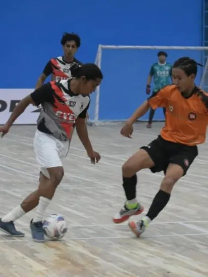 One-on-one battle during a futsal match. This format is excellent for developing individual defensive and attacking skills.