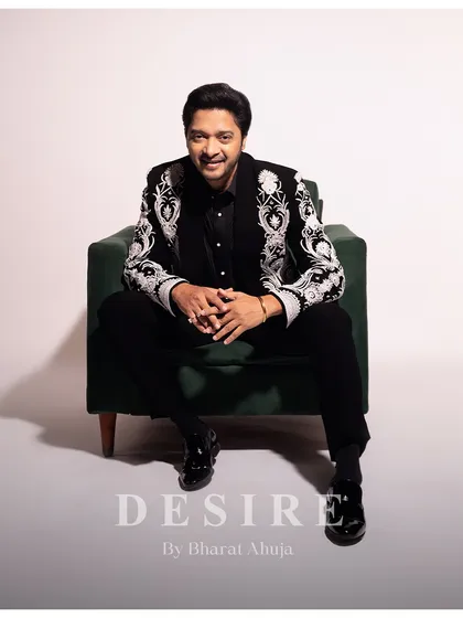A portrait of quiet confidence. The detailed silver embroidery on this black blazer is a testament to the art of bespoke tailoring and luxury design.