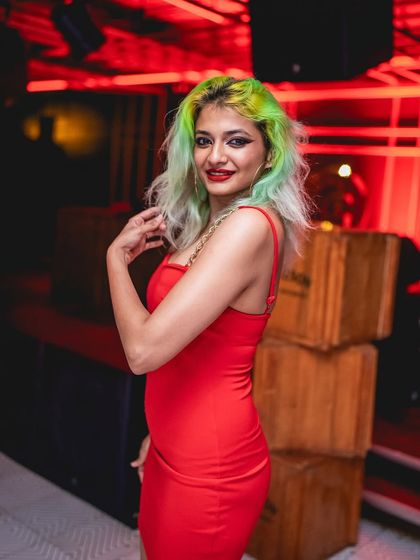 A guest with vibrant green hair at Gawky Goose, showing the creative and expressive crowd my events attract.