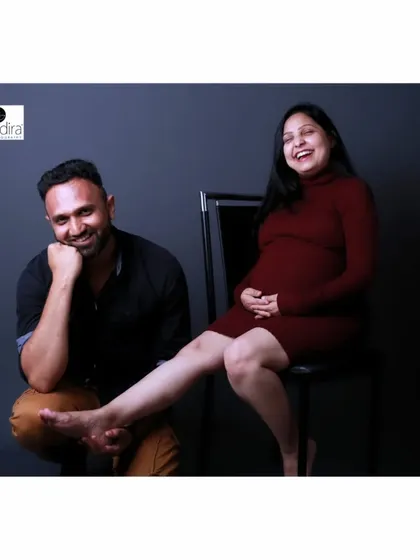 The couple shares a laugh in this candid shot, showing the genuine fun and comfort I strive for in every session.