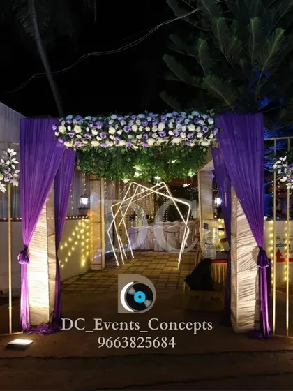 The same elegant purple-themed entrance for the Roce ceremony, viewed from a different angle to show how it frames the path into the event space.