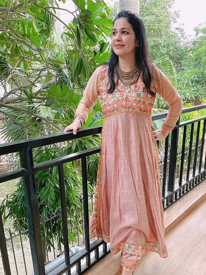This peach Anarkali with floral embroidery is a beautiful and feminine outfit. It's one of my favorite looks for a daytime wedding function.