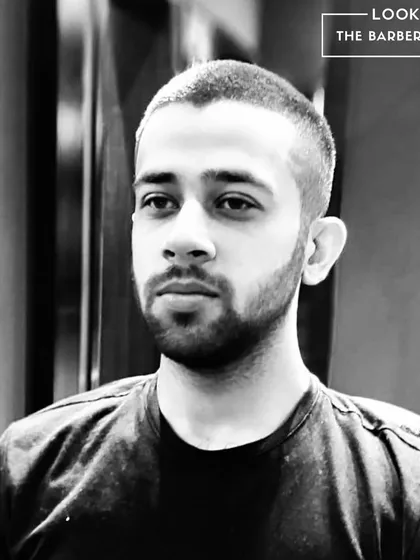 A frontal view of a clean buzz cut with a skin fade. It's a low-maintenance, high-impact style that always looks sharp.
