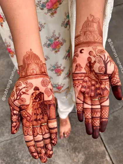 This is the kind of art that tells a story. A detailed Karvachauth design featuring a couple, capturing the essence of the festival in henna.